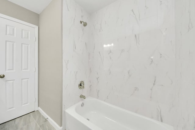 5722 Beldart St, Houston, TX 77033 - full bathroom featuring baseboards and shower / washtub combination