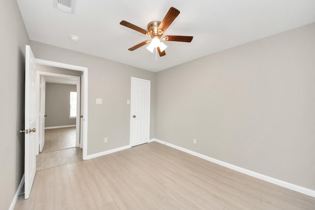 5722 Beldart St, Houston, TX 77033 - unfurnished bedroom with light wood-type flooring and a ceiling fan