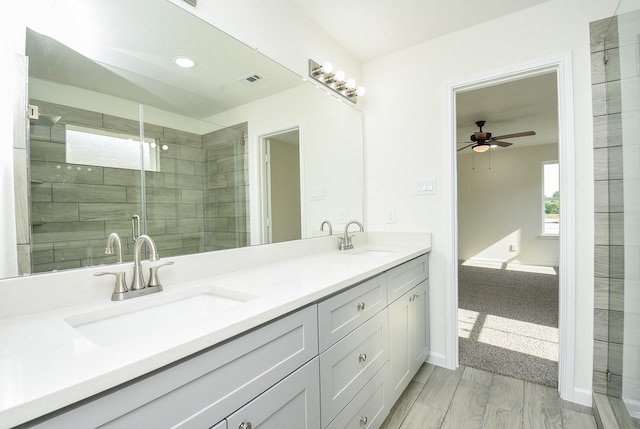2807 Pine Estate Ln, Houston, TX 77014 - full bathroom with ceiling fan, double vanity, a shower stall, and recessed lighting