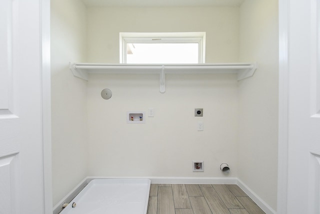 2807 Pine Estate Ln, Houston, TX 77014 - laundry room featuring hookup for a gas dryer, hookup for an electric dryer, hookup for a washing machine, and wood finished floors