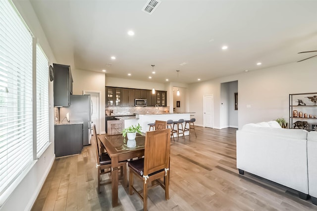 1638 Dominion Heights Ln, Katy, TX 77423 - dining area featuring light wood-type flooring and recessed lighting