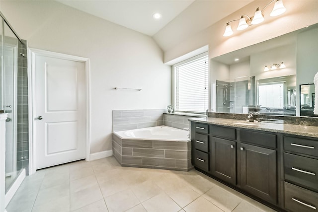 1638 Dominion Heights Ln, Katy, TX 77423 - bathroom featuring vanity, a shower stall, a bath, tile patterned floors, and lofted ceiling