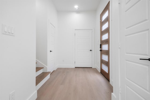 6815 Paris St, Houston, TX 77021 - foyer featuring light wood-style flooring, stairs, and recessed lighting
