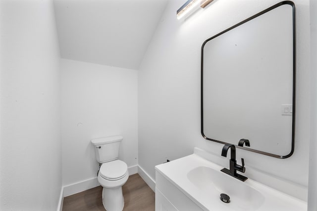 6815 Paris St, Houston, TX 77021 - bathroom featuring wood finished floors, vanity, and lofted ceiling