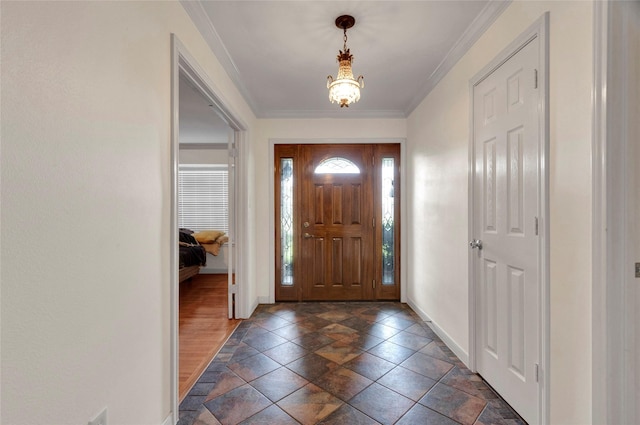 2010 Oceanview Dr, Seabrook, TX 77586 - foyer entrance with a chandelier and ornamental molding