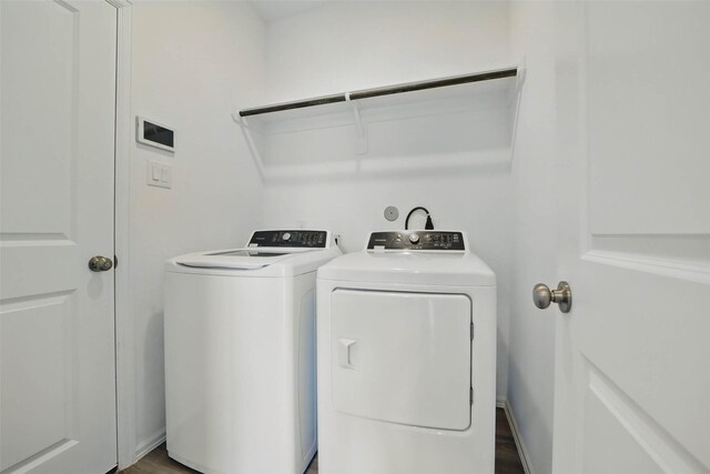 2921 Eden Lake Ln, Katy, TX 77493 - washroom with washer and clothes dryer and wood finished floors