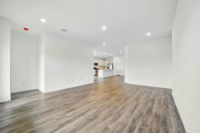 2921 Eden Lake Ln, Katy, TX 77493 - unfurnished living room featuring recessed lighting and light wood finished floors