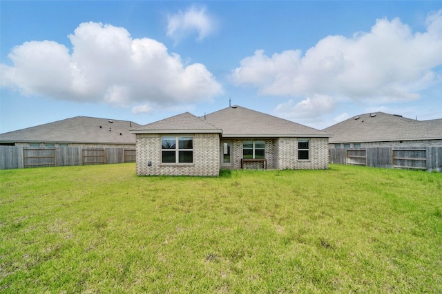 2921 Eden Lake Ln, Katy, TX 77493 - rear view of property with a fenced backyard and brick siding
