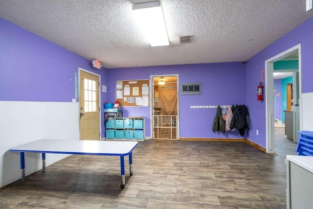 402 W Converse St, Weimar, TX 78962 - office area featuring a textured ceiling and wood finished floors
