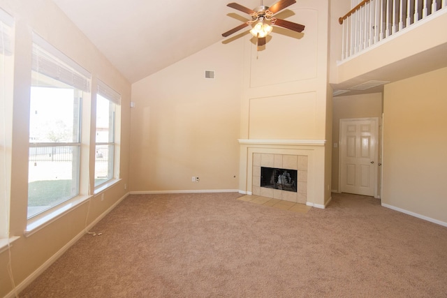 8603 E Windhaven Terrace Trl, Cypress, TX 77433 - unfurnished living room with high vaulted ceiling, carpet floors, healthy amount of natural light, ceiling fan, and a fireplace