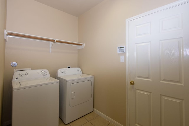 8603 E Windhaven Terrace Trl, Cypress, TX 77433 - laundry area featuring washer and dryer and light tile patterned floors