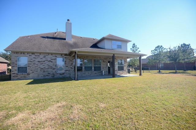 8603 E Windhaven Terrace Trl, Cypress, TX 77433 - rear view of property with a patio area, brick siding, a chimney, and a shingled roof