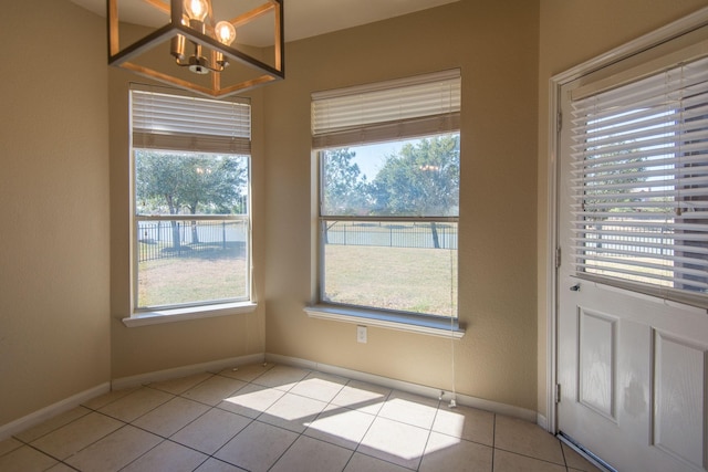 8603 E Windhaven Terrace Trl, Cypress, TX 77433 - unfurnished dining area with a chandelier and light tile patterned floors