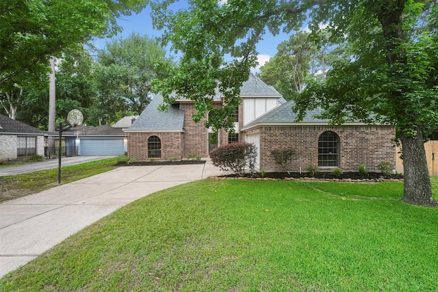 4327 Long Glen Dr, Houston, TX 77339 - view of front of property featuring a shingled roof, brick siding, and driveway