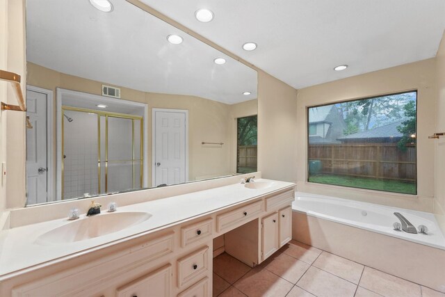 4327 Long Glen Dr, Houston, TX 77339 - bathroom with double vanity, tile patterned flooring, a garden tub, a stall shower, and recessed lighting