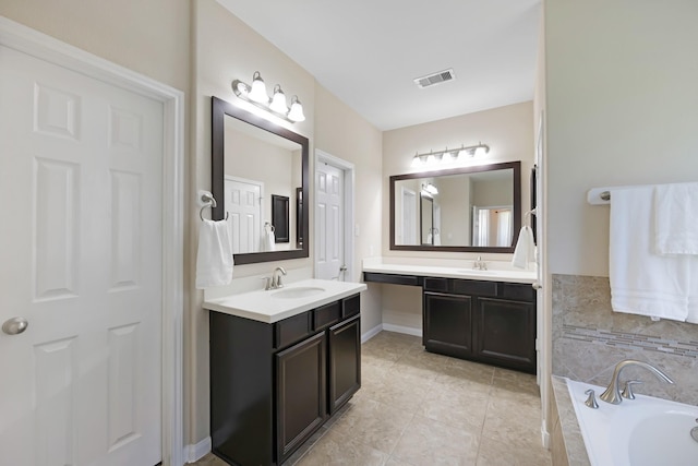 19610 Blushing Meadow Dr, Cypress, TX 77433 - full bath with two vanities, a bath, and tile patterned floors