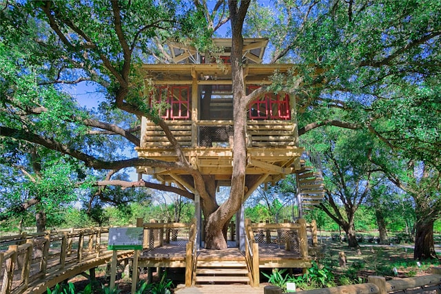 19610 Blushing Meadow Dr, Cypress, TX 77433 - back of property with a wooden deck and stairway