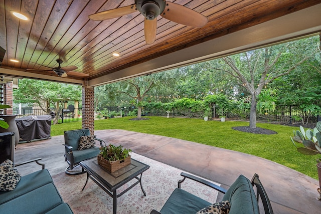 19610 Blushing Meadow Dr, Cypress, TX 77433 - fenced backyard featuring a ceiling fan, a patio area, an outdoor living space, and area for grilling