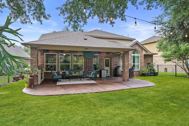 19610 Blushing Meadow Dr, Cypress, TX 77433 - back of house featuring brick siding, an outdoor living space, a patio, and a shingled roof