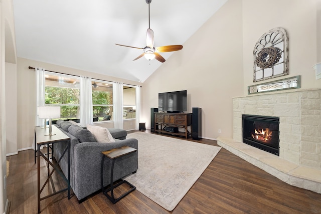 19610 Blushing Meadow Dr, Cypress, TX 77433 - living room with a ceiling fan, high vaulted ceiling, dark wood-style floors, and a fireplace