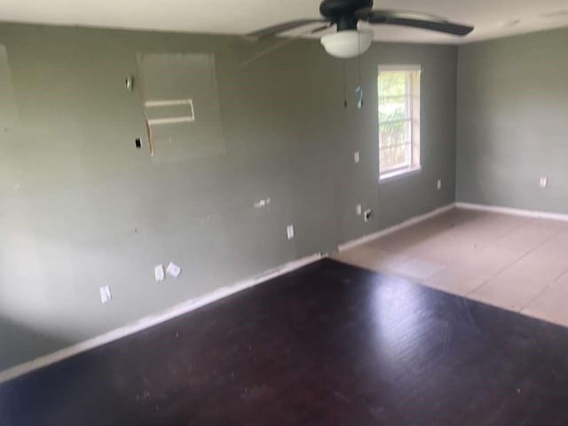 503 Willow St, Rosenberg, TX 77471 - spare room featuring baseboards and a ceiling fan