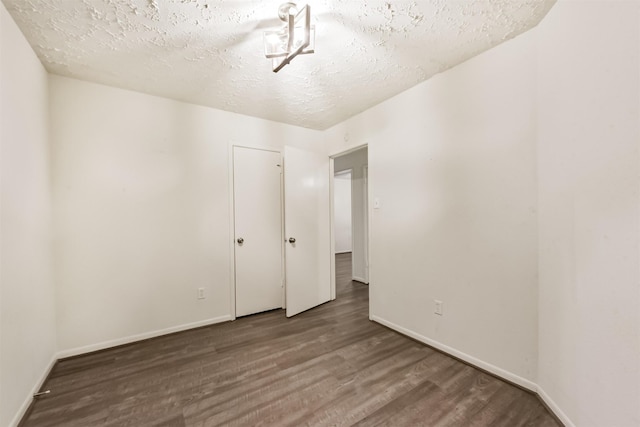 622 Magnolia Bend St, League City, TX 77573 - unfurnished room featuring wood finished floors and a textured ceiling