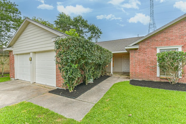 622 Magnolia Bend St, League City, TX 77573 - single story home with brick siding, a front yard, and a detached garage