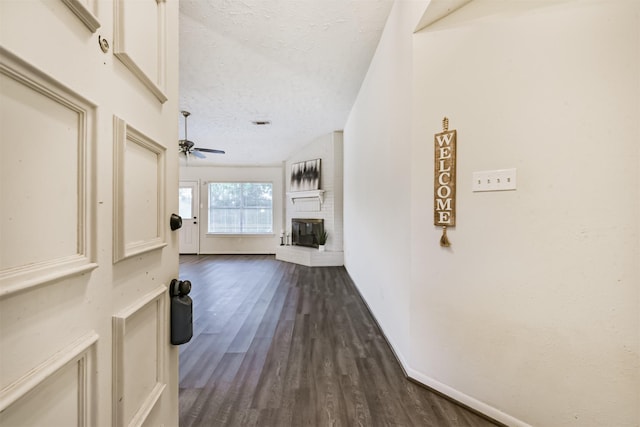 622 Magnolia Bend St, League City, TX 77573 - hallway with a textured ceiling and dark wood-type flooring