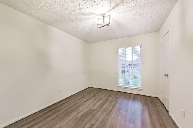 622 Magnolia Bend St, League City, TX 77573 - unfurnished room with wood finished floors and a textured ceiling