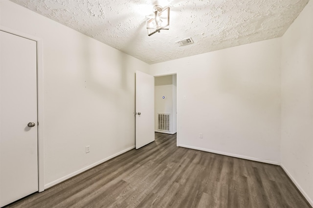 622 Magnolia Bend St, League City, TX 77573 - empty room with wood finished floors and a textured ceiling
