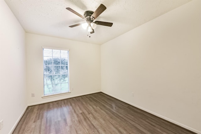 622 Magnolia Bend St, League City, TX 77573 - empty room with dark wood-style flooring, a ceiling fan, and a textured ceiling