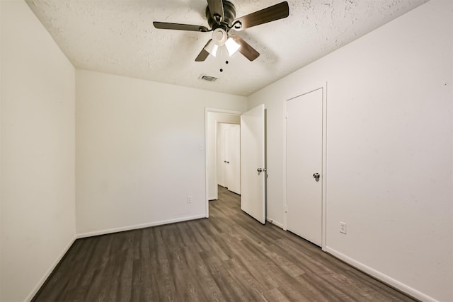 622 Magnolia Bend St, League City, TX 77573 - unfurnished bedroom featuring wood finished floors, a textured ceiling, and a ceiling fan