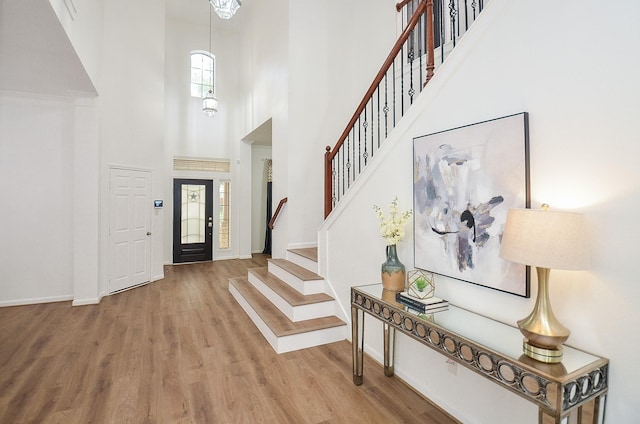 25619 Tower Side Ln, Katy, TX 77494 - foyer entrance with a high ceiling, wood finished floors, and stairs