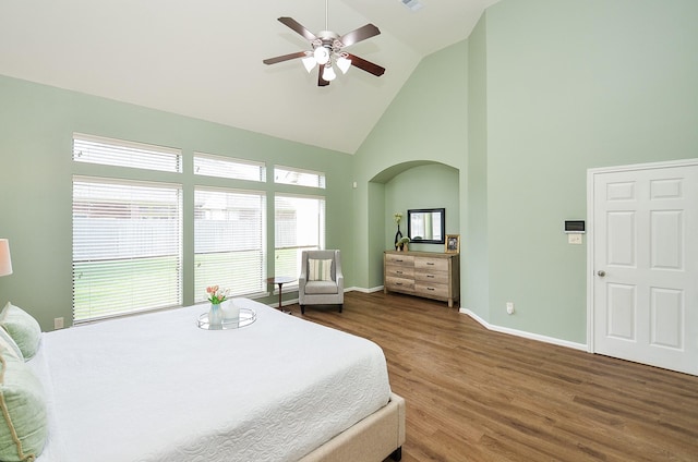 25619 Tower Side Ln, Katy, TX 77494 - bedroom featuring high vaulted ceiling, wood finished floors, arched walkways, and a ceiling fan