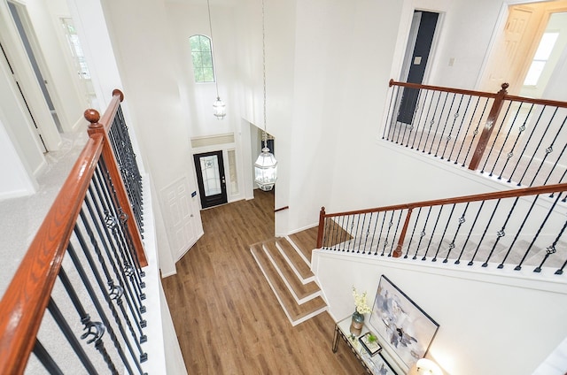 25619 Tower Side Ln, Katy, TX 77494 - foyer entrance with wood finished floors and a towering ceiling