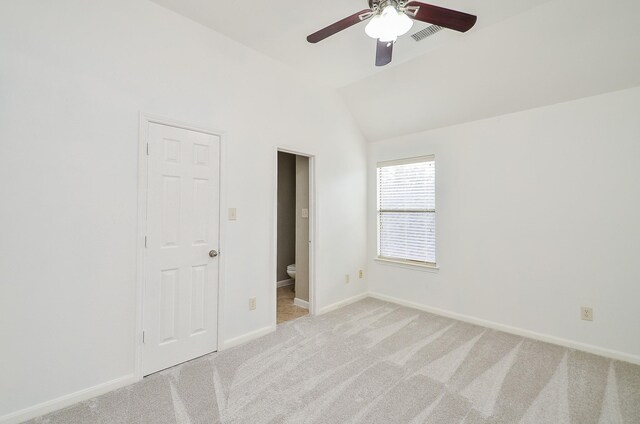 25619 Tower Side Ln, Katy, TX 77494 - unfurnished bedroom with light colored carpet, lofted ceiling, connected bathroom, and a ceiling fan