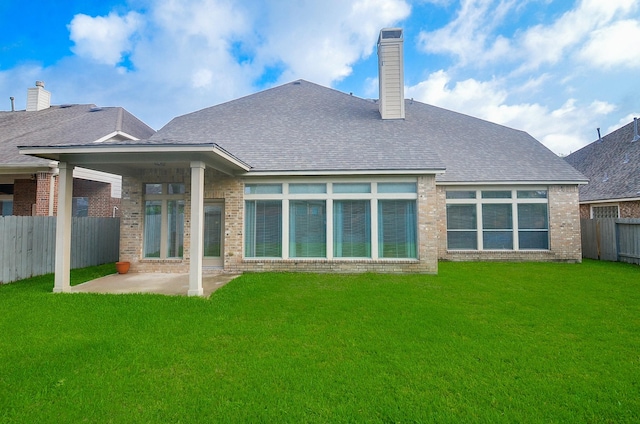 25619 Tower Side Ln, Katy, TX 77494 - rear view of property with a patio, a fenced backyard, brick siding, and a shingled roof