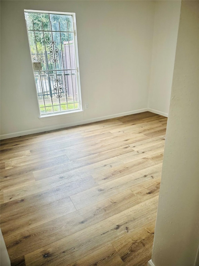 9350 Country Creek Dr Unit 58, Houston, TX 77036 - empty room featuring healthy amount of natural light and wood finished floors