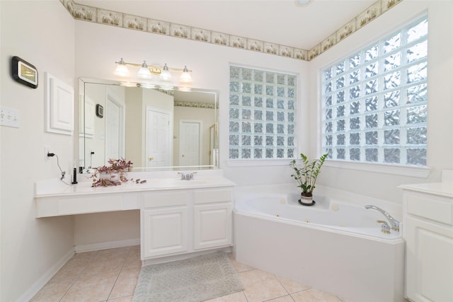 7311 Open Oak Way, Humble, TX 77346 - bathroom with a whirlpool tub, vanity, and tile patterned flooring