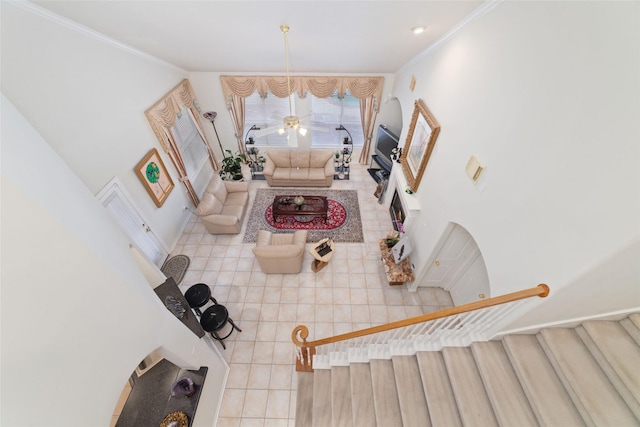 7311 Open Oak Way, Humble, TX 77346 - tiled living room featuring ornamental molding and ceiling fan