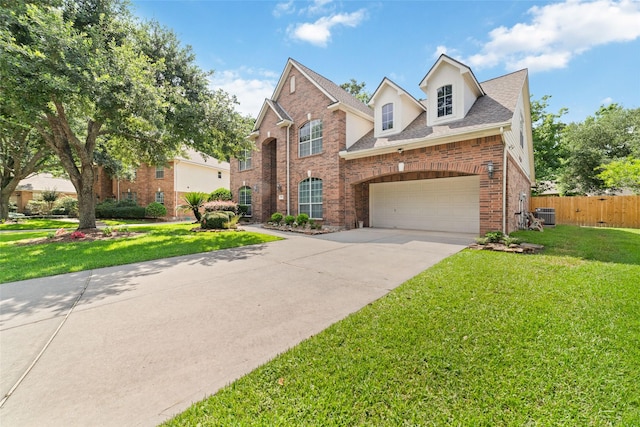 7311 Open Oak Way, Humble, TX 77346 - traditional home featuring brick siding, driveway, and roof with shingles
