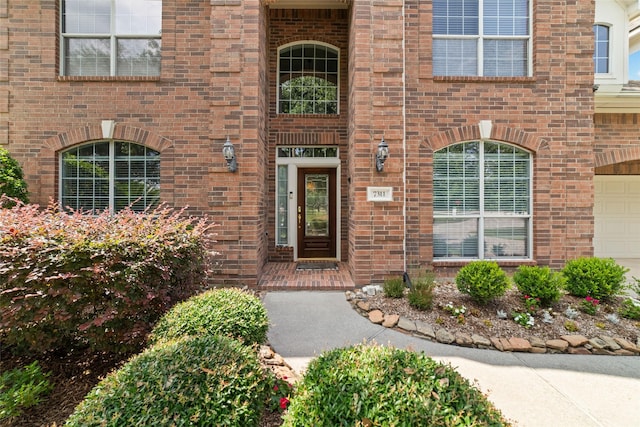 7311 Open Oak Way, Humble, TX 77346 - property entrance featuring brick siding and a garage