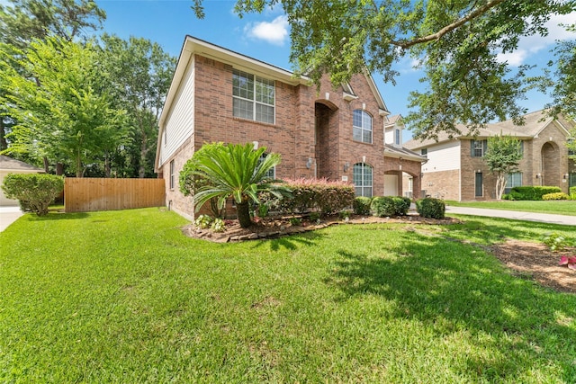 7311 Open Oak Way, Humble, TX 77346 - traditional-style home with brick siding and driveway
