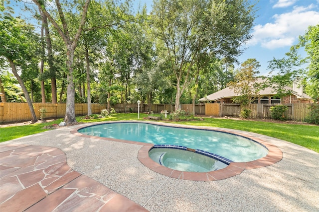 7311 Open Oak Way, Humble, TX 77346 - view of swimming pool featuring a fenced backyard, a pool with connected hot tub, and a patio area