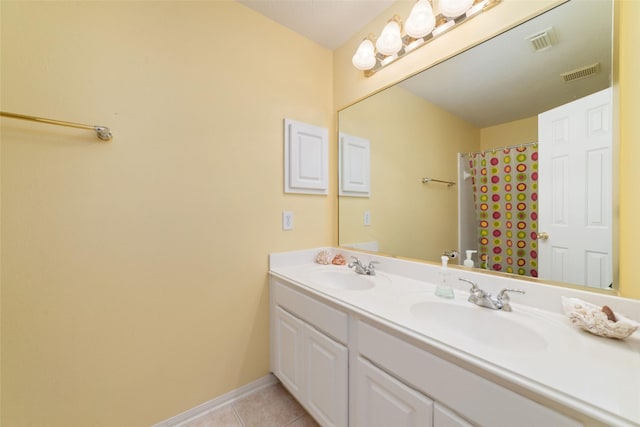 7311 Open Oak Way, Humble, TX 77346 - full bathroom featuring double vanity and tile patterned flooring