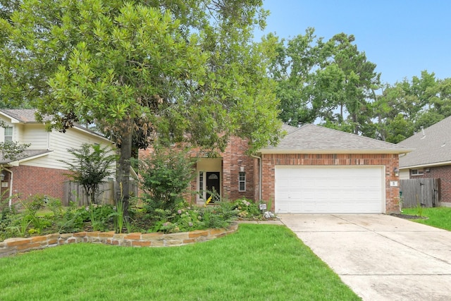 31 S Creekmist Pl, Conroe, TX 77385 - view of front facade featuring brick siding, an attached garage, concrete driveway, and a shingled roof