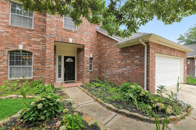 31 S Creekmist Pl, Conroe, TX 77385 - view of front of house with an attached garage, driveway, brick siding, and roof with shingles