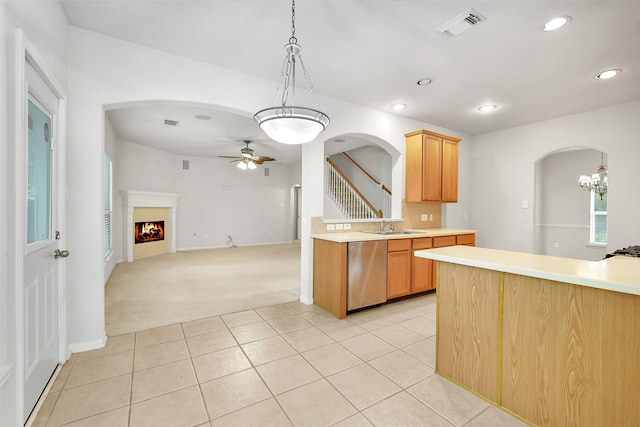 31 S Creekmist Pl, Conroe, TX 77385 - kitchen with stainless steel dishwasher, light countertops, arched walkways, light carpet, and recessed lighting