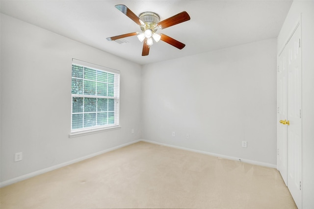 31 S Creekmist Pl, Conroe, TX 77385 - unfurnished room with light colored carpet and a ceiling fan