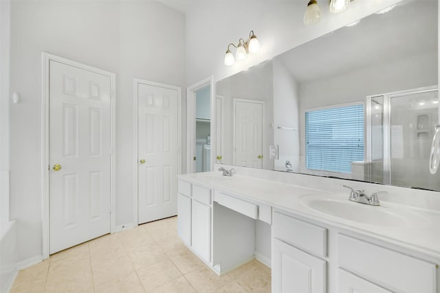 31 S Creekmist Pl, Conroe, TX 77385 - bathroom featuring tile patterned flooring, a stall shower, and double vanity